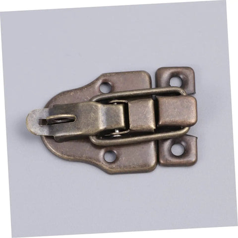 Close-up of a Vintage Wooden Box Hasps And Cabinet Toggle Latches Set 2 Pack Antique Brass Duckbilled Catch for wooden cabinets.