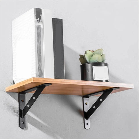 Heavy Duty Triangle Corner Brackets Built Tough For Floating Shelves And Scaffold Boards Rock Solid Right Angle Wall Mounts Kickass Steel Hardware For Your Next Project Pack Of Two holding a wooden shelf with books and a plant.