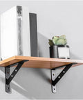Heavy Duty Corner Brackets For Floating Shelves with wood shelf, black triangle supports, and decorative plant in pot.