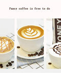 Three cups of fancy latte art with coffee beans, featuring intricate designs in foam on white cups on a tiled surface.