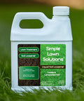 Front view of Liquid Soil Loosener and Soil Conditioner bottle for compact soils by Simple Lawn Solutions placed on grass.