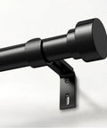 Heavy Duty Black Curtain Rod For Windows 66 To 120 Inches, 1 Inch Diameter, Adjustable, with decorative metal finial.
