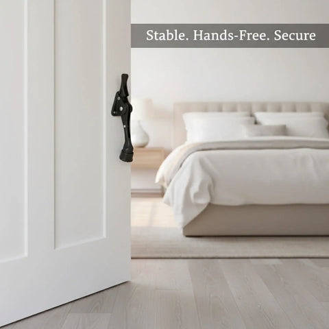 Foot Operated Door Stop For Hands Free Entryway Access, Zinc Alloy Floor Holder in bedroom setting, door partially open