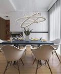 Lit Three Ring LED Crystal Chandelier With Stainless Steel Frame, Dimmable Brightness, 4000K LED in a modern dining room