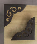 Solid As A Rock Metal Corner Protectors For Furniture featuring dope vintage floral accents, black metal guards on wood.
