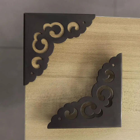 Solid As A Rock Metal Corner Protectors For Furniture featuring dope vintage floral accents, black metal guards on wood.