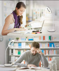 Eye Caring LED Desk Lamp With 3 Color Modes No Glare And Four Brightness Levels Dimmable With Adapter Touch Control And 360 Degree Flexible Neck Ideal For Home Office And Study Desks shown in use by two people reading at separate desks.