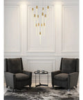 Modern 13 Bulb Pendant Ceiling Light Featuring Satin Gold Hardware And Clear Crystals above gray armchairs and table in elegant room.