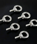 Close-up of 304 Stainless Steel M5 Eyebolts Set with Lock Nuts Lock Washers and Flat Washers 36 Pieces for Lifting and Machinery Use Built Tough for Real Rigging Gear on black background.