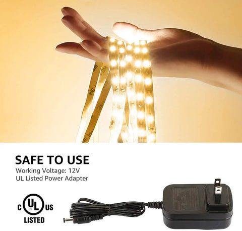Dimmable 16.4Ft White LED Strip Light 3000K Warm White held in hand, with 12V UL Listed adapter, showcasing strong 3M adhesive.