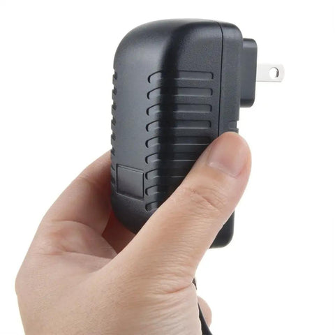 Hand holding AC Power Adapter For Casio CDP S100 88 Key Digital Piano Keyboard Replacement Power Supply CE FCC RoHS Certified