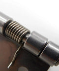 Close-up of Ten Pack Small Spring Iron Hinges For Furniture And Boxes Push And Pull Two Way Hardware, silver finish.