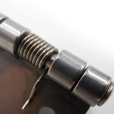 Close-up of Ten Pack Small Spring Iron Hinges For Furniture And Boxes Push And Pull Two Way Hardware, silver finish.