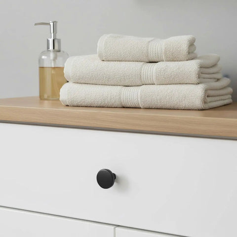 Two Pack Black Bifold Closet Door Knobs for Cabinets and Drawers, Round Matte Black Dresser Knob Hardware Pulls with Screws, Durable Aluminum Alloy Furniture Handles for Cabinets, Bifold Doors, and Dressers on white drawer