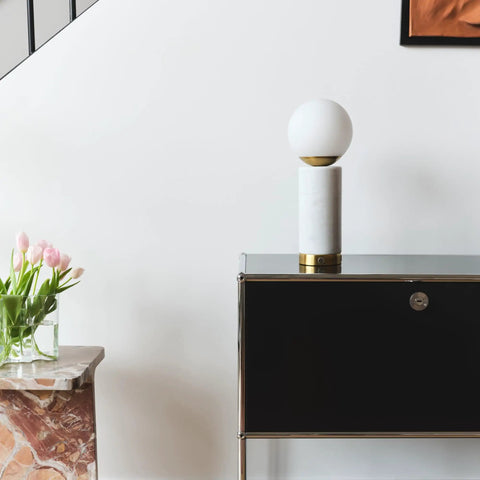Aspen LED Table Lamp With USB Port For Bedside Or Desk Ambient Lighting And Marble Finish Globe Shade on a sideboard