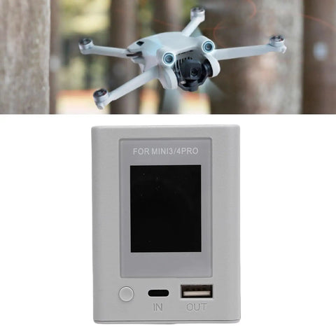 Drone Battery Charger Hub With 45W PD Fast Charging And LCD Display For Mini 3 3 Pro 4 Pro Batteries shown with drone.