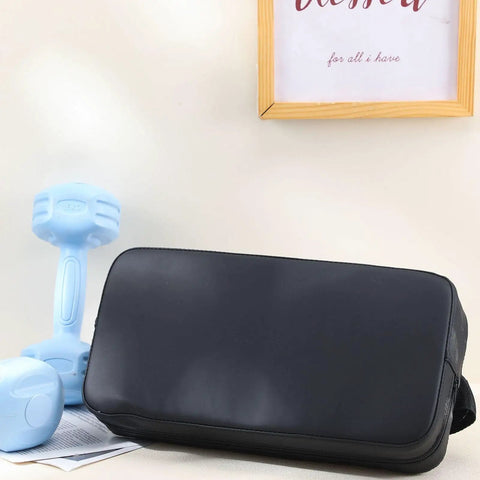 Back Pad For Bench Press And Chest Press Support Non Slip PVC Leather Foam Cushioned Pad For Free Weight Benches Home Gym Strength Training Fits Incline Decline And Flat Presses 13.8 X 7.1 X 3.3 Inches next to blue dumbbells.