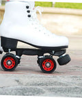 2 Pcs Adjustable Rubber Toe Stops for Roller Skates attached to white quad skates on outdoor pavement