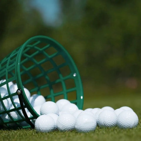 Go To Green Practice Golf Ball Basket with Foldable Handle Holds Up To 50 Balls on grass at driving range