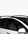 Built Tough Aluminum Roof Rack For Tesla Model Y Handling Up To 165 LBS With Secure Integrated Locks shown on vehicle roof.