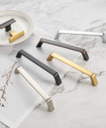 Various styles of cabinet pulls in different finishes on marble surface, including 10 Pack 5 Inch Oil Rubbed Bronze Cabinet Pulls Set For Kitchen Cabinets Drawers.