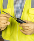 Person holding TORX Cushion Grip Screwdriver Set, 5 Piece With T15 T20 T25 T27 T30 Bits, shown with chrome shaft and color-coded handle.