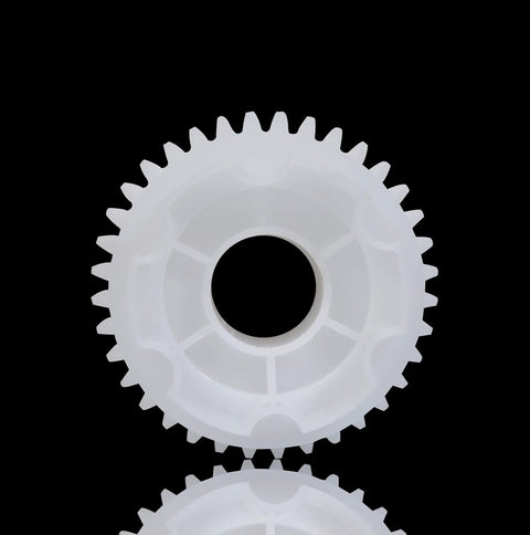 Close-up of white gear from 550 Gear Box Kit For Kids Ride On Cars All In One Large Middle And Small Gears Drive Accessories Set