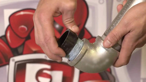 Hands applying Megaloc Multi-Purpose Thread Sealant Can Blue Liquid Paste 8 Oz 236 Ml One Half Pint Kevlar Reinforced to pipe connection.