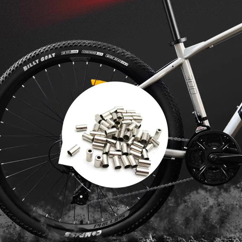 50 Pack Bike Cable End Caps And Brake Cable Ends Aluminum Alloy Crimps against bicycle wheel backdrop