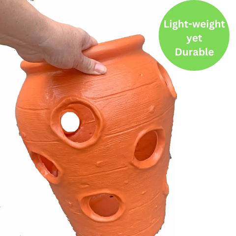 Hand holding Strawberry Jar Planter With Twelve Side Openings For Herbs Flowers And Succulents Durable Lightweight Terra Cotta Colored