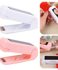 Slick Mini Portable Handheld Bag Sealer For Fresh Snack Storage And Grocery Plastic Packaging Clamps Hassle Free Heat Seal Tool Compact Kitchen Gadget White and pink bag sealers with open handles.