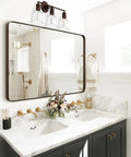 Three Light Vanity Light Dope Oil Rubbed Bronze With Clear Cylinder Glass Over Mirror Bathroom Fixture above sink