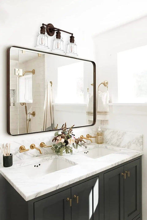 Three Light Vanity Light Dope Oil Rubbed Bronze With Clear Cylinder Glass Over Mirror Bathroom Fixture above sink