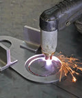 Magnetic Holders For Plasma Cutting Straight Edge And Stencil Positioning, 2 Pack, in use on metal surface with sparks visible