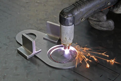 Magnetic Holders For Plasma Cutting Straight Edge And Stencil Positioning, 2 Pack, in use on metal surface with sparks visible