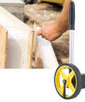 LiebeWH Measuring Wheel 0-9999.9m Telescopic Handle 0.5% Accuracy in use measuring distance on construction site.