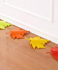 Leaf Shape Door Stopper 4 Pack with Sturdy PP Wedges Anti Skid Bottom Finger Protector shown under white door