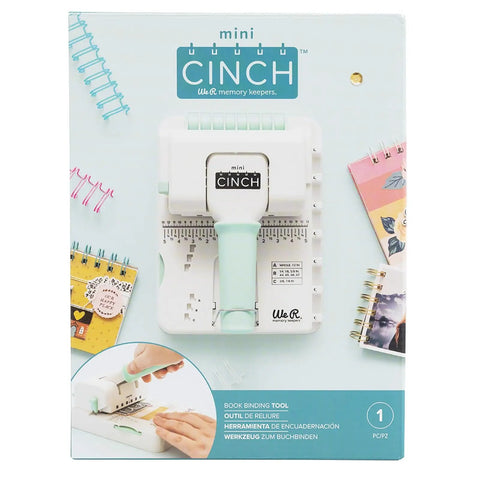 Front view of Mini Cinch Binding Tool for DIY Books and Notebooks with Wire or Spiral Coils in packaging on light blue background.