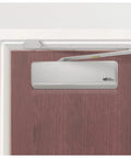 4400 Series Cast Iron Door Closer Grade 1 Built Tough Multi Mount Adjustable Size 1 to 6 ADA Compliant UL Listed Aluminum Construction Smooth Quiet Close with Latching and Backcheck visible on a wooden door