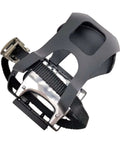 Close-up of bike pedals with toe clips and straps for indoor cycling and home gym training, showing the grippy non-slip surface.