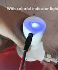 Hand holding 50W Portable Micro Hydroelectric Turbine Generator For Tap Water And Streams with indicator lights and cable connected.