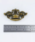 Antique Brass Ring Pull Handles For Cabinets And Drawers, Vintage Drop Ring Knobs With Screws, shown with measuring ruler for size