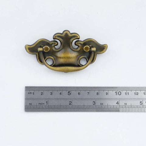 Antique Brass Ring Pull Handles For Cabinets And Drawers, Vintage Drop Ring Knobs With Screws, shown with measuring ruler for size