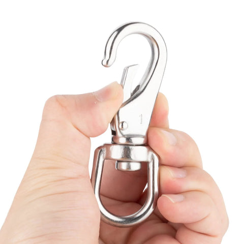 Front view of a 3-1/2 in stainless steel swivel eye snap hook held by a hand