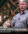 Man holding knuckle bender tool in front of industrial background. Text about bender protection design.