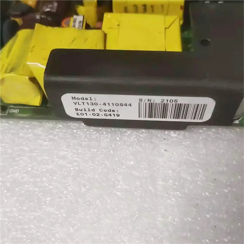 Solid Workhorse Industrial Power Supply VLT130 4110S44 label visible with components, compact AC DC converter for machines.