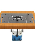 Top Notch Aluminum Router Table Insert Plate Featuring Crisp Measurement Scale And Rock Solid Flip Base For High Precision Woodworking Jobs Finished Off Nicely In Cool Sky Blue on a workbench.