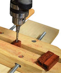 Drill mounted above wooden base with red wood block, demonstrating use of 7 Piece Pen Mill Trimmer Set Featuring Heavy Duty Steel Cutter And Multi Size Pilot Shafts For 7Mm 8Mm 10Mm Tubes.