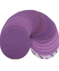 Top Shelf 5 Inch Sanding Discs With Hook Loop Backing For Super Fast Changes On Wood Furniture Metal Grinding And Auto Polishing Projects In 60 To 10000 Grit Range Including Pro Grade 20 Pack showing assorted purple grit discs.