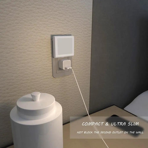 Plug In LED Night Light With Auto Dusk To Dawn Sensor And Stepless Brightness Adjustment From 0 To 15 Lumens in an outlet